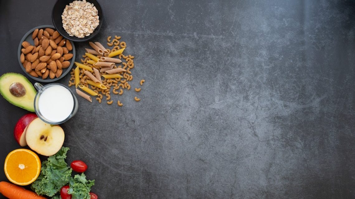 a black table topped with fruits and vegetables